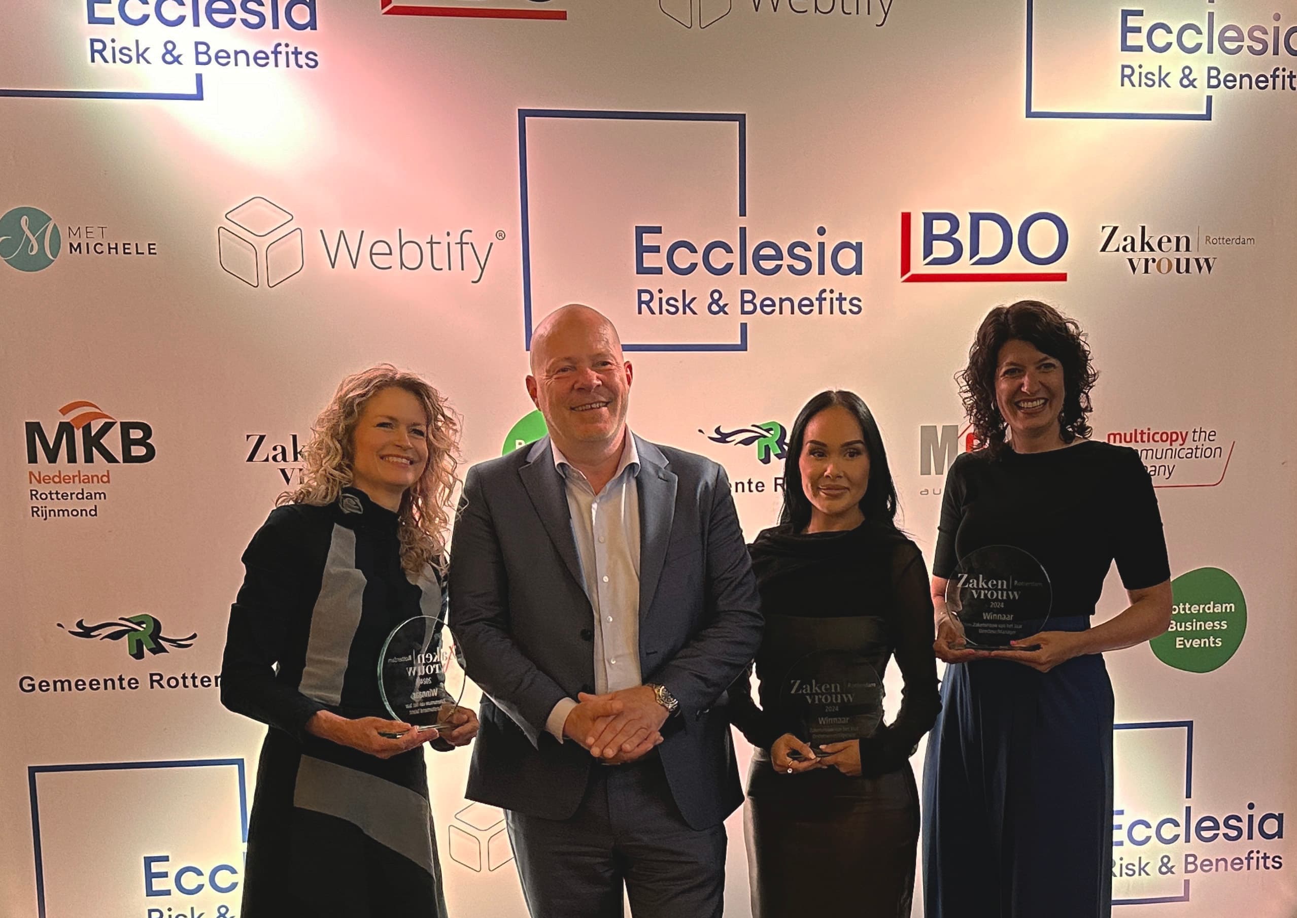 Oxious founder Esther Smit, at left, winning the award for Rotterdam Business Woman of the Year 2024 in the category of upcoming talent